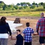 family walking on the beach