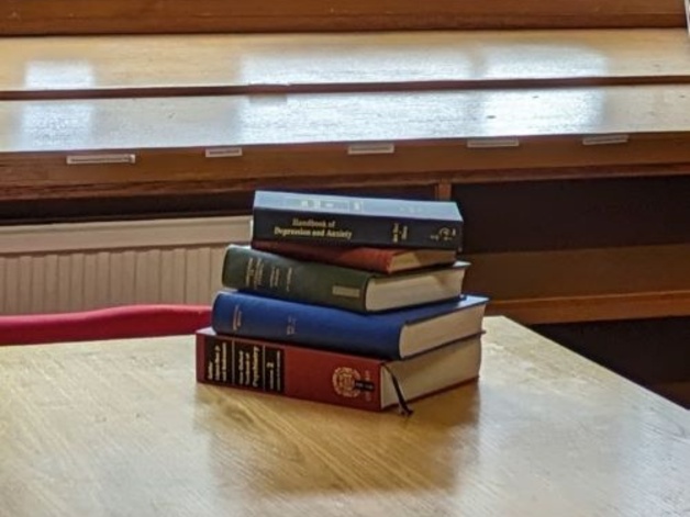 A stack of books in the Psychology Library.