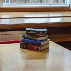 A stack of books in the Psychology Library.